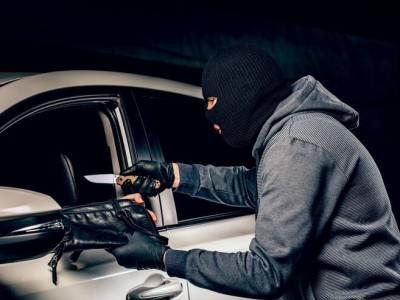 man-with-balaclava-his-head-tried-get-into-car-he-uses-screwdriver_544249-5213